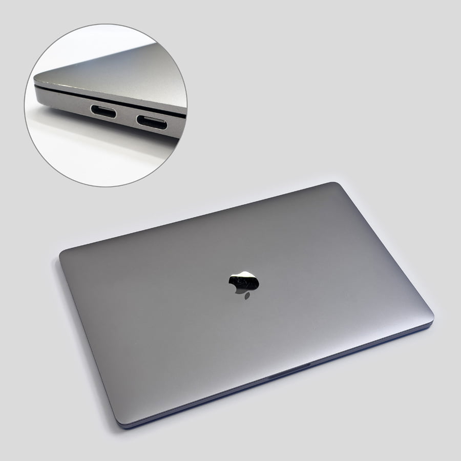 Macbook Pro i bra skick. Visar ett chassi med smärre spår av användning.