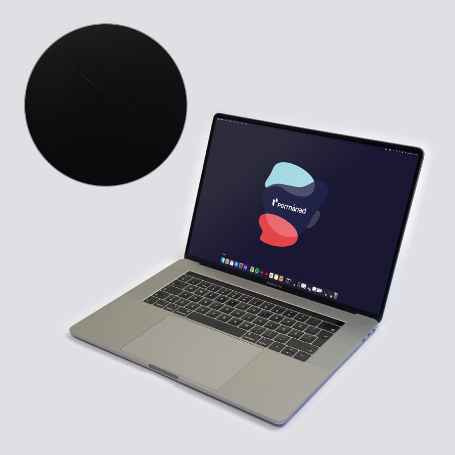 Macbook Pro i utmärkt skick. Visar en skärm och chassi med minimalt slitage
